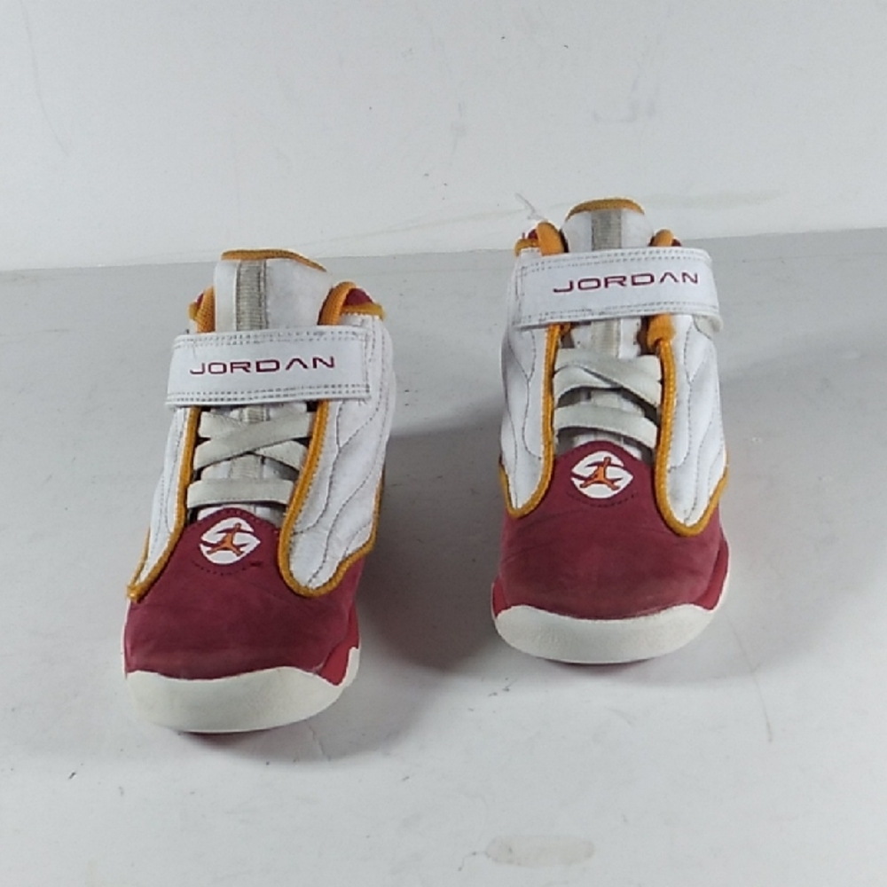Jordan Kids' Red and White Sneakers with Gold Accents.